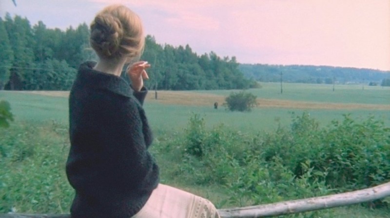 mirror-1974-003-woman-sitting-on-fence