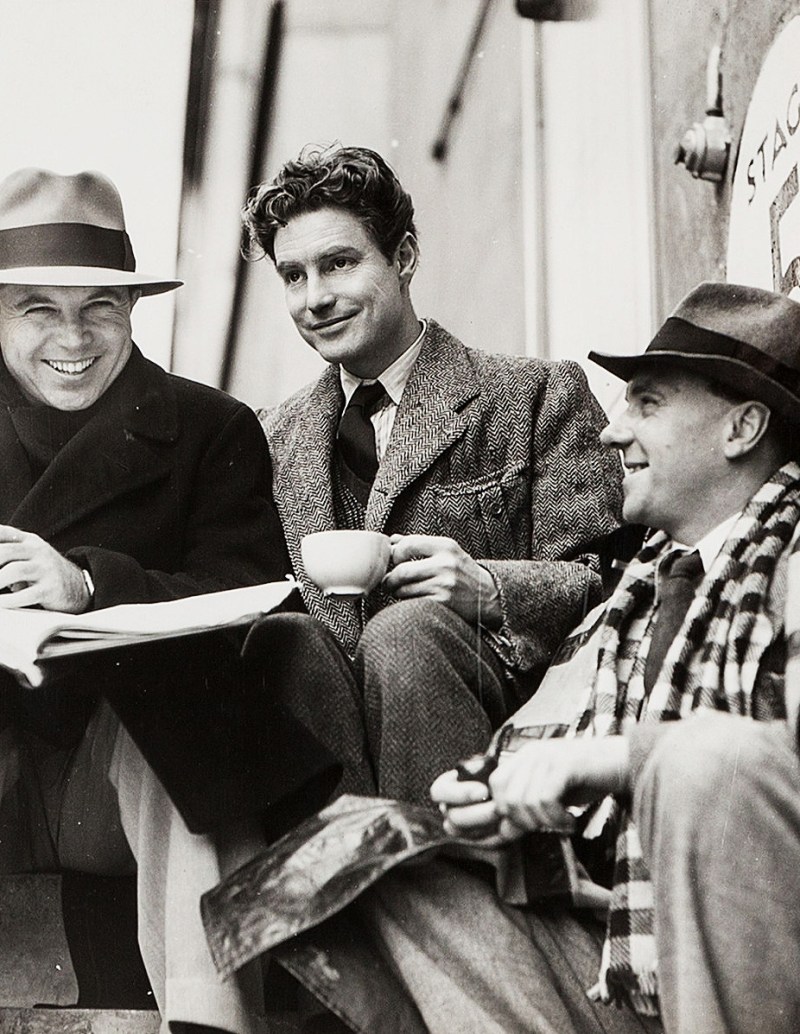 King Vidor, Robert Donat and Ralph Richardson outside the Denham sound stage during filming of The Citadel (1938)